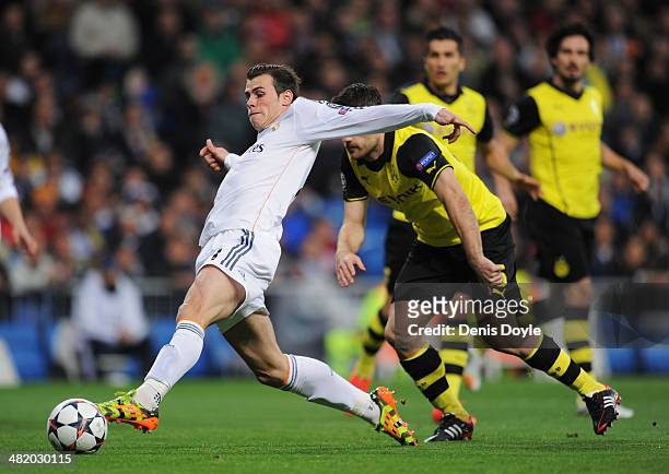 Gareth Bale of Real Madrid scores the opening goal during the UEFA Champions League Quarter Final first leg match between Real Madrid and Borussia...