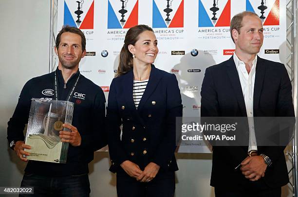 Prince William, Duke of Cambridge and Catherine, Duchess of Cambridge pose with Sir Ben Ainslie, skipper of Britain's Land Rover-backed BAR team,...