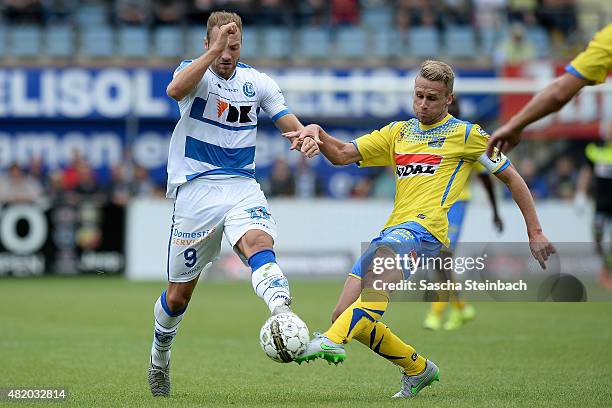 Laurent Deptoire of Gent vies with Filip Daems of Westerlo during the Jupiler league match between KVC Westerlo and KAA Gent at Het Kuipje on July...