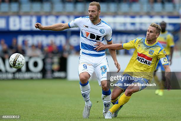 Laurent Deptoire of Gent vies with Filip Daems of Westerlo during the Jupiler league match between KVC Westerlo and KAA Gent at Het Kuipje on July...