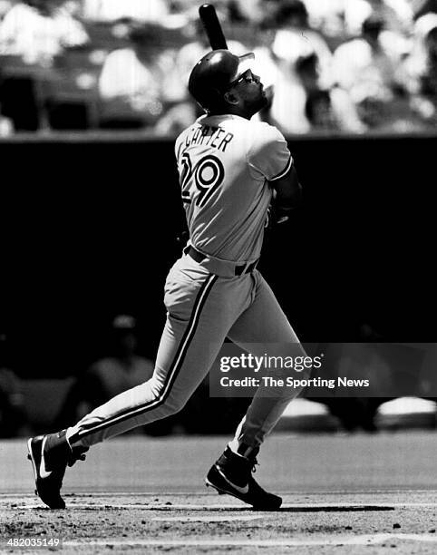 Joe Carter of the Toronto Blue Jays bats circa 1990s.