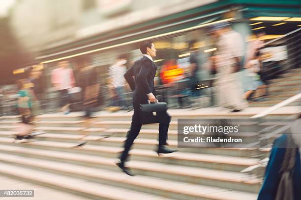 businessman running on the street - japanese tree stockfoto's en -beelden