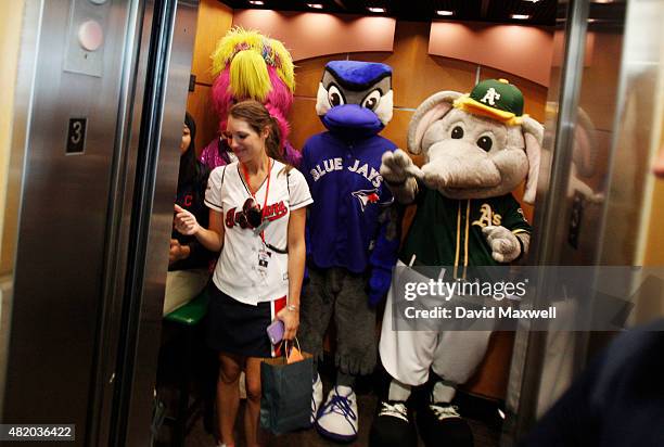 Baseball Mascots Slider of the Cleveland Indians, Ace of the Toronto Blue Jays, and Stomper of the Oakland A's ride in an elevator before the start...