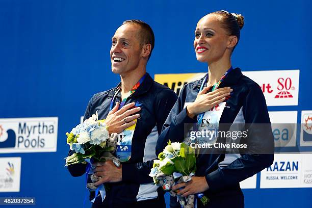 Gold medallists Bill May and Christina Jones of the United States celebrate during the medal ceremony for the Mixed Duet Technical Synchronised...