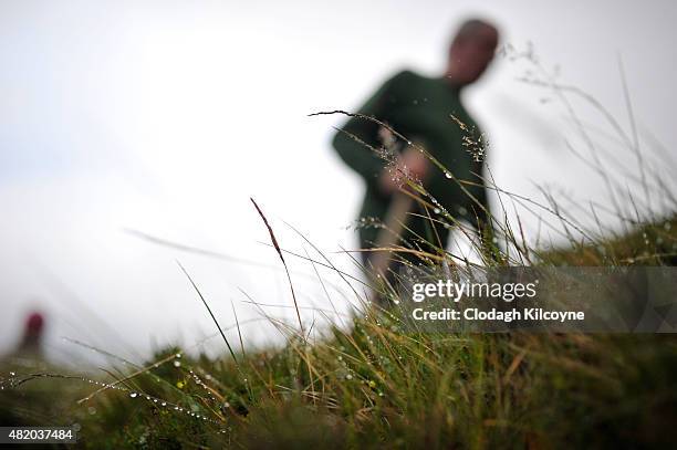 Rain coats the bog lining the pilgrim path up Croagh Patrick during the annual Irish Christian pilgrimage of climbing up Croagh Patrick mountain...