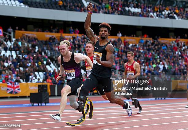 Richard Browne of the USA crosses the line to win the Men's 100m T44 ahead of Jonnie Peacock of Great Britain during the IPC Grand Prix Final on Day...