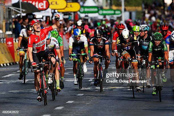 Andre Greipel of Germany and Lotto-Soudal celebrates as he crosses the finish line to win the twenty first stage of the 2015 Tour de France, a 109.5...