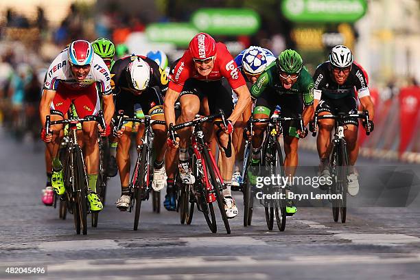 Andre Greipel of Germany and Lotto-Soudal leads the bunch sprint to the finish line to win the twenty first stage of the 2015 Tour de France, a 109.5...