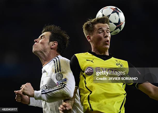 Real Madrid's Welsh striker Gareth Bale vies with Dortmund's defender Erik Durm during the UEFA Champions League quarterfinal first leg football...