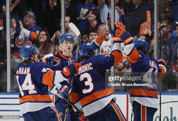 Mike Halmo of the New York Islanders celebrates his first NHL goal at 4:21 of the third period against the Florida Panthers at the Nassau Veterans...