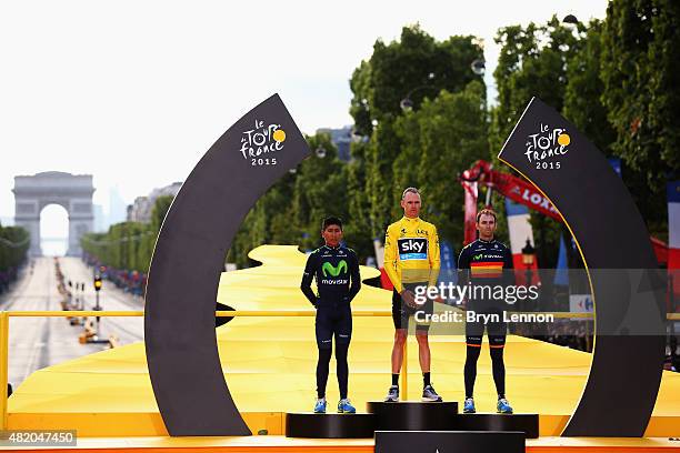 Tour de France winner Chris Froome of Great Britain and Team Sky celebrates alongside second placed Nairo Quintana of Colombia and Movistar Team and...