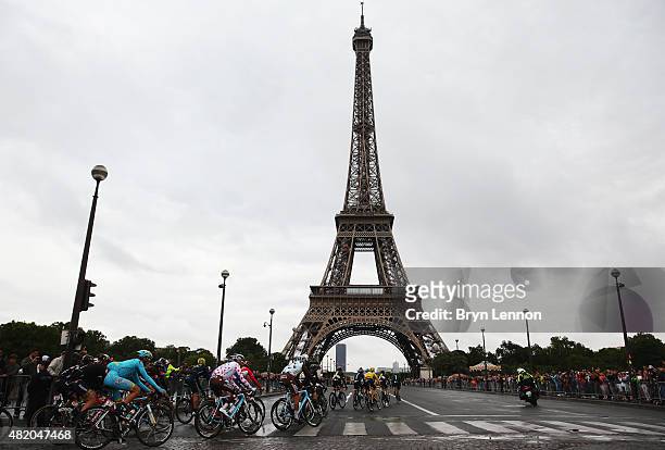 Chris Froome of Great Britain and Team Sky rides past the Eiffel Tower on his way to overall victory during the twenty first stage of the 2015 Tour...