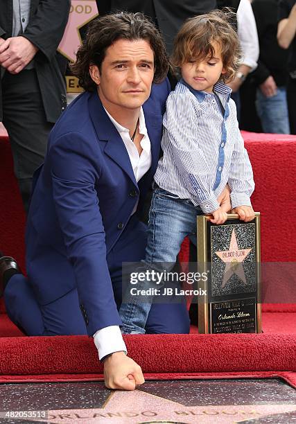 Orlando Bloom and his son Flynn Bloom are honored with a star on the Walk of Fame on April 2, 2014 in Hollywood, California.