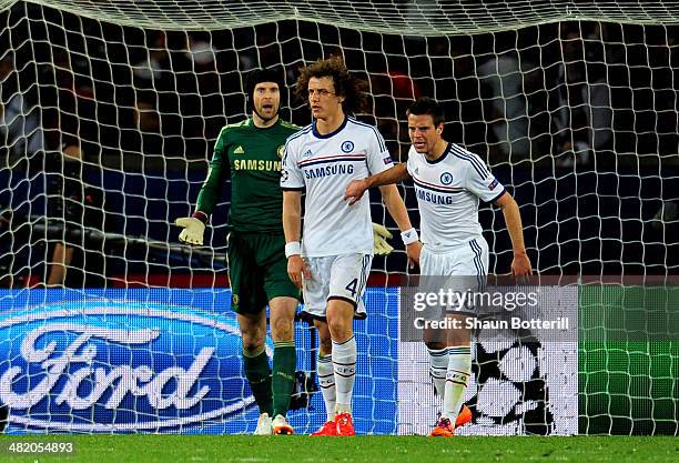 Goalkeeper Petr Cech looks on in disbelief after David Luiz of Chelsea scores an own goal to give PSG a 2-1 lead during the UEFA Champions League...