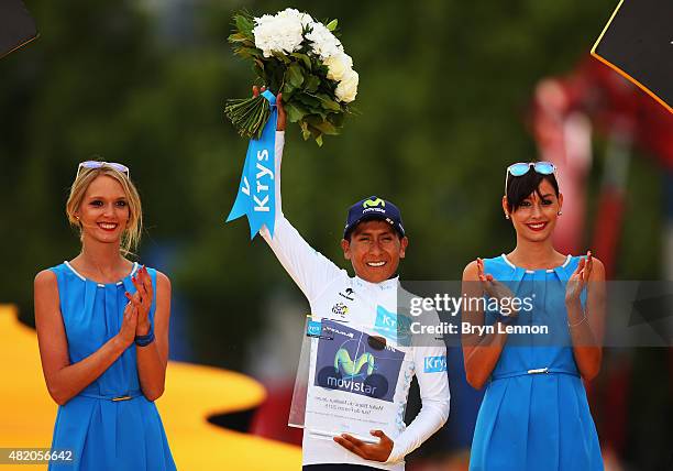 Nairo Quintana of Colombia and Movistar Team celebrates after winning the white jersey for the best young rider following the twenty first stage of...