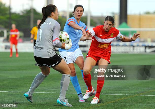 Sabrina D'Angelo of the Western New York Flash takes control of a loose ball in front of Carli Lloyd of the Houston Dash and Brittany Taylor of the...