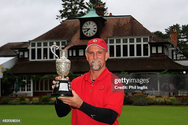 Marco Dawson of United States poses with the trophy after the final round of The Senior Open Championship played at the Old Course, Sunningdale Golf...