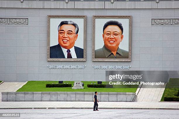 north korea dprk: walking across kim il sung square - kim jong il bildbanksfoton och bilder