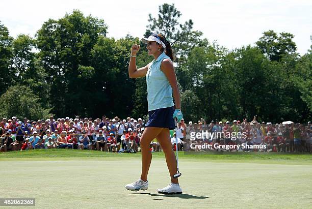 Lexi Thompson reacts after making a par putt on the 18th green to win the Meijer LPGA Classic presented by Kraft at Blythefield Country Club on July...