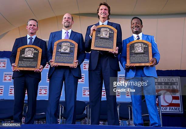Inductees Craig Biggio,John Smoltz,Randy Johnson and Pedro Martinez pose with their plaques after the Induction Ceremony at National Baseball Hall of...