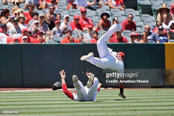 Erick Aybar and Matt Joyce of the Los Angeles Angels of Anaheim collide while trying to catch a fly ball in the fourth inning during a game against...