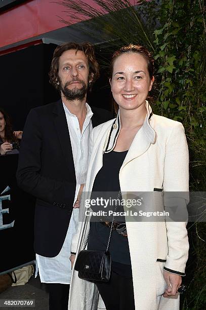 Harumi Klossowska De Rola and her husband Benoit Peverelli attend the Paris Premiere of "NOAH" at Cinema Gaumont Marignan on April 1, 2014 in Paris,...