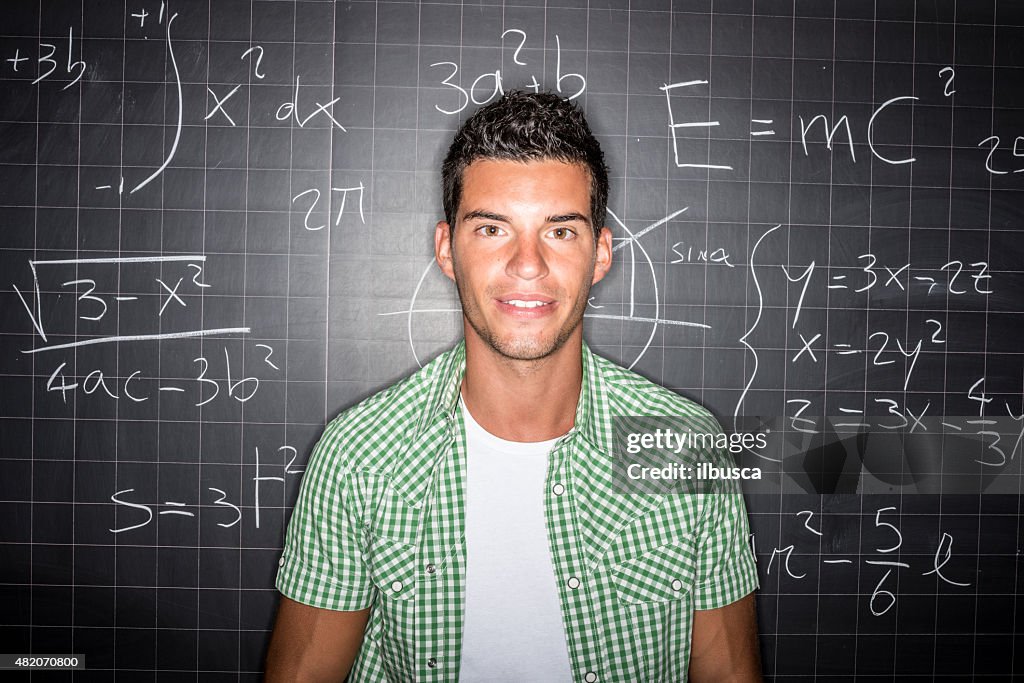 School education portraits: student genius in front of blackboard