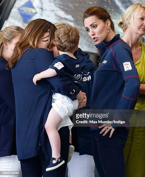 Catherine, Duchess of Cambridge meets workers and families during a visit to the Ben Ainslie Racing team base as she attends the America's Cup World...