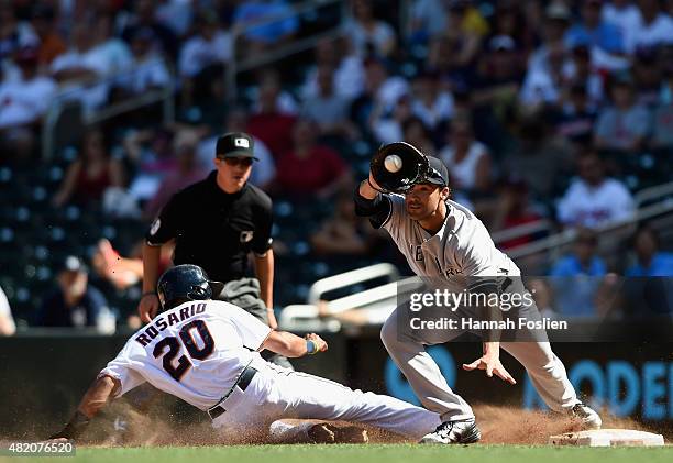 Eddie Rosario of the Minnesota Twins is caught off first base by Garrett Jones of the New York Yankees to end the game on July 26, 2015 at Target...