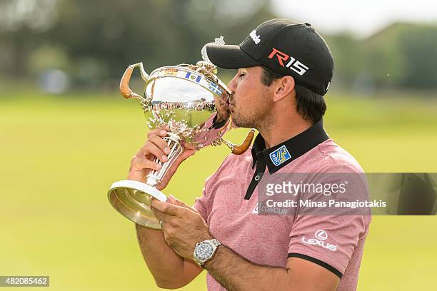 Jason Day of Australia kisses the RBC Canadian Open Cup at Glen Abbey Golf Course on July 26, 2015 in Oakville, Ontario, Canada.