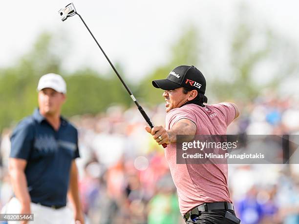 Jason Day of Australia celebrates after sinking his putt on the eighteenth hole in the final round and becomes the 2015 RBC Canadian Open champion at...