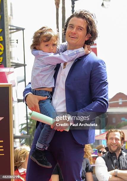 Actor Orlando Bloom with his son Flynn Bloom is honored with a Star on The Hollywood Walk Of Fame on April 2, 2014 in Hollywood, California.