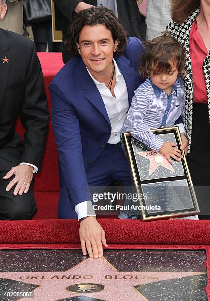 Actor Orlando Bloom with his son Flynn Bloom is honored with a Star on The Hollywood Walk Of Fame on April 2, 2014 in Hollywood, California.