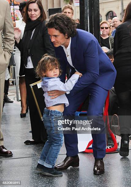 Actor Orlando Bloom with his son Flynn Bloom is honored with a Star on The Hollywood Walk Of Fame on April 2, 2014 in Hollywood, California.