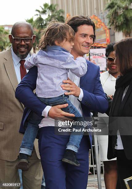 Actor Orlando Bloom with his son Flynn Bloom is honored with a Star on The Hollywood Walk Of Fame on April 2, 2014 in Hollywood, California.