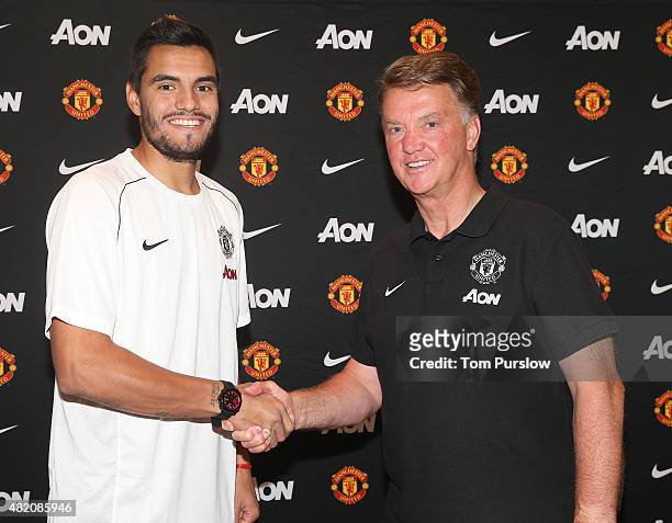 Sergio Romero of Manchester United poses with manager Louis van Gaal after signing for the club on July 26, 2015 in San Jose, California.