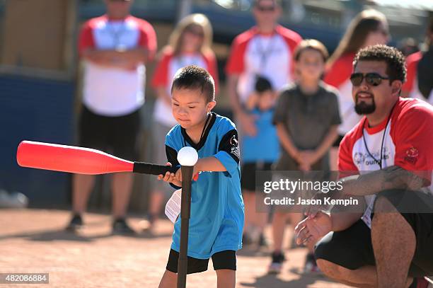 Young Athletes experience the excitement and thrill of participating in softball activities on a worldwide stage through the Toys"R"Us...