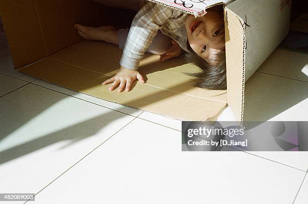 Hiding In Box Child Hiding In Box Photos and Premium High Res Pictures - Getty Images