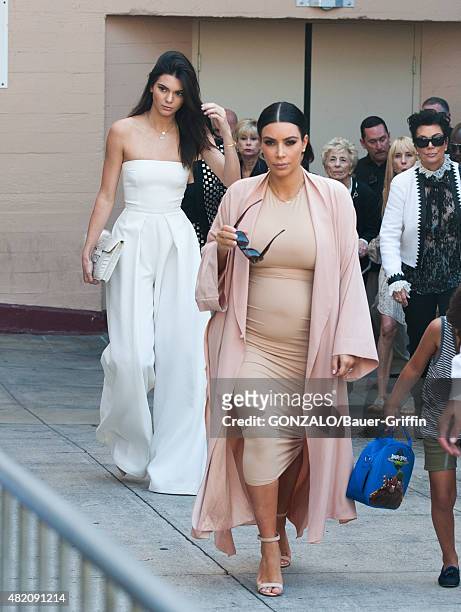 Kendall Jenner and Kim Kardashian are seen on July 26, 2015 in Los Angeles, California.