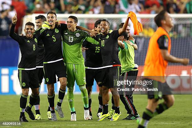 Giovani Dos Santos of Mexico and teammates celebrate after defeating Jamaica in the CONCACAF Gold Cup Final at Lincoln Financial Field on July 26,...