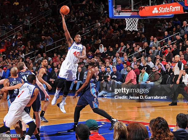 Jarvis Varnado of the Philadelphia 76ers shoots against the Charlotte Bobcats at the Wells Fargo Center on April 2, 2014 in Philadelphia,...