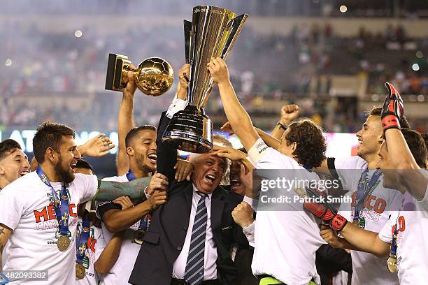 Mexican Football Federation president Justino Compean and team Mexico celebrate after defeating Jamaica in the CONCACAF Gold Cup Final at Lincoln...
