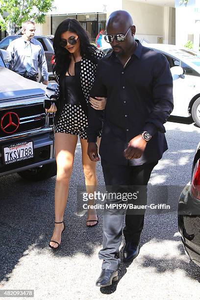 Kylie Jenner and Corey Gamble pictured as The Kardashian Family leave a showing of Phantom of the Opera and then arrive at the Ivy on July 26, 2015...