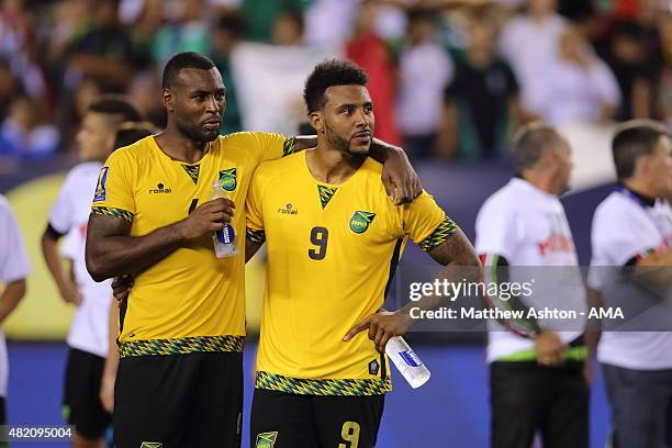 Dejected players Wes Morgan of Jamaica and Giles Barnes of Jamaica after the 2015 CONCACAF Gold Cup Final match between Jamaica and Mexico at Lincoln...