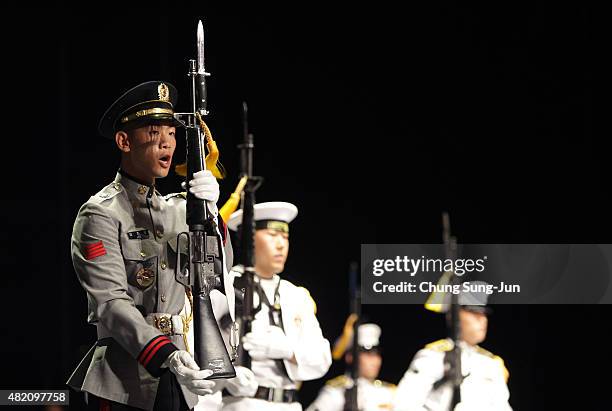 South Korean honor guard perform during the ceremony to commemorate the 62nd Anniversary of the Korean War armistice agreement on July 27, 2015 in...