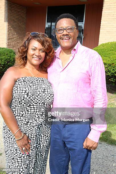 Linda Mathis and husband Judge Greg Mathis posing at Mathis Community Center on July 26, 2015 in Detroit, Michigan.