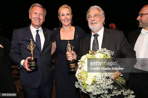 Christian Wulff with award and his wife Bettina Wulff , Placido Domingo during the 'Die Goldene Deutschland' Gala on July 26, 2015 at Cuvillies...