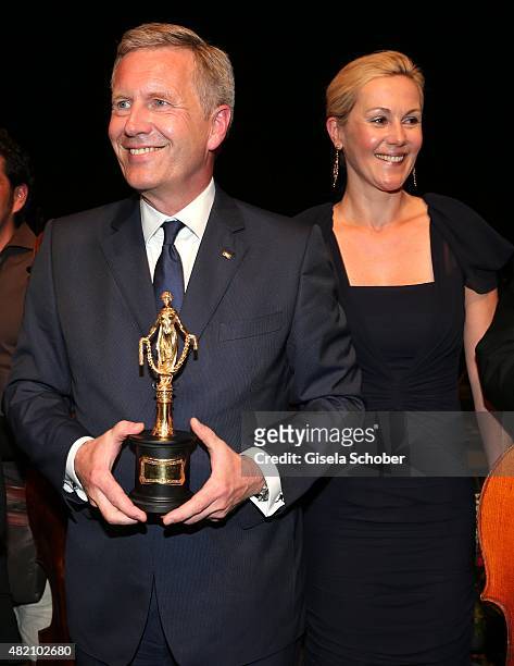 Christian Wulff with award and his wife Bettina Wulff during the 'Die Goldene Deutschland' Gala on July 26, 2015 at Cuvillies Theater in Munich,...