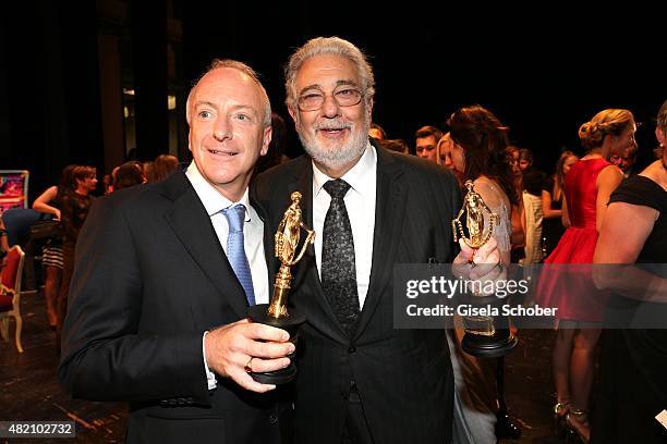 Richard Blackford, Placido Domingo with award during the 'Die Goldene Deutschland' Gala on July 26, 2015 at Cuvillies Theater in Munich, Germany.