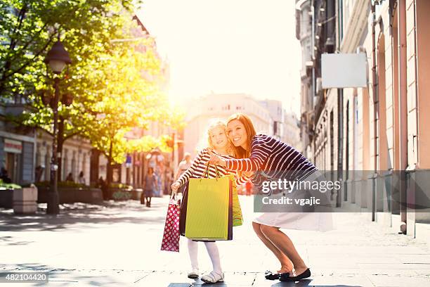 mother and daughter enjoy shopping together. - knez mihailova street stock pictures, royalty-free photos & images